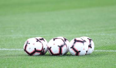 Footballs on Pitch