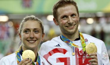 Laura Trott, now Laura Kenny, celebrates an Olympic gold medal with husband Jason Kenny